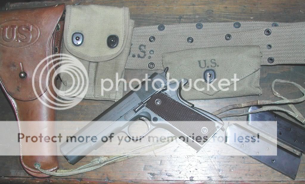 Earlyphotoof1911A1ColtPistolandrig.jpg